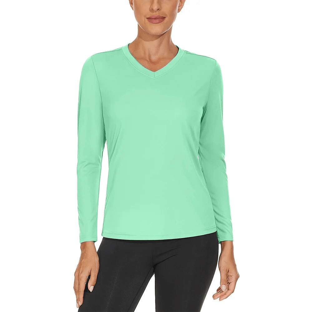 Sun-protective women's V-neck sports top with long sleeves, made of breathable polyester, ideal for hiking. Color: mint green.